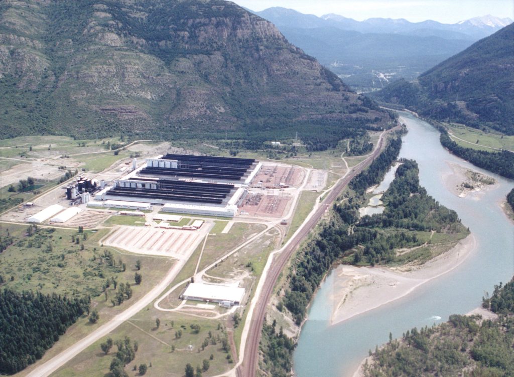 Aerial view of aluminum smelter near river.