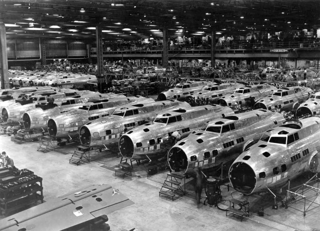 B-17 bombers under construction in factory.